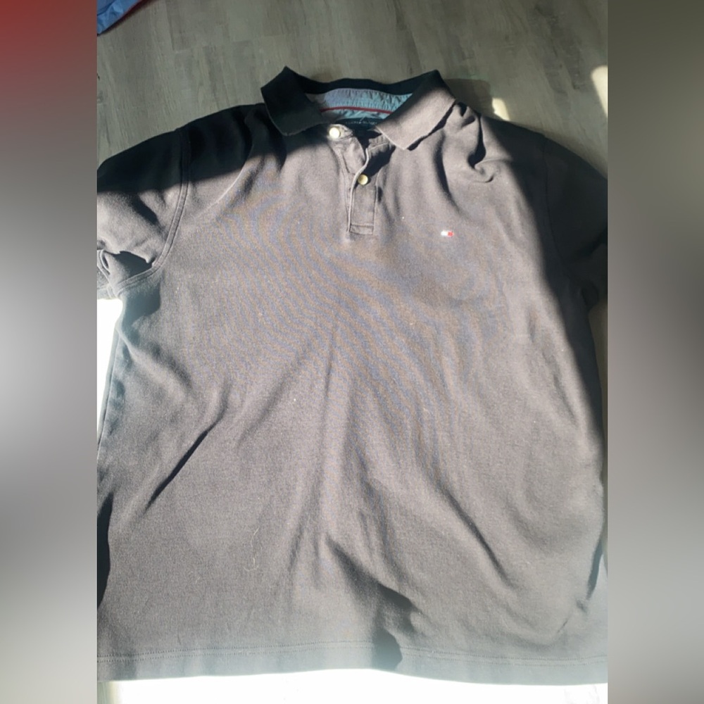 Tommy shirt New bought took tags off tried it on and it didn’t fit.